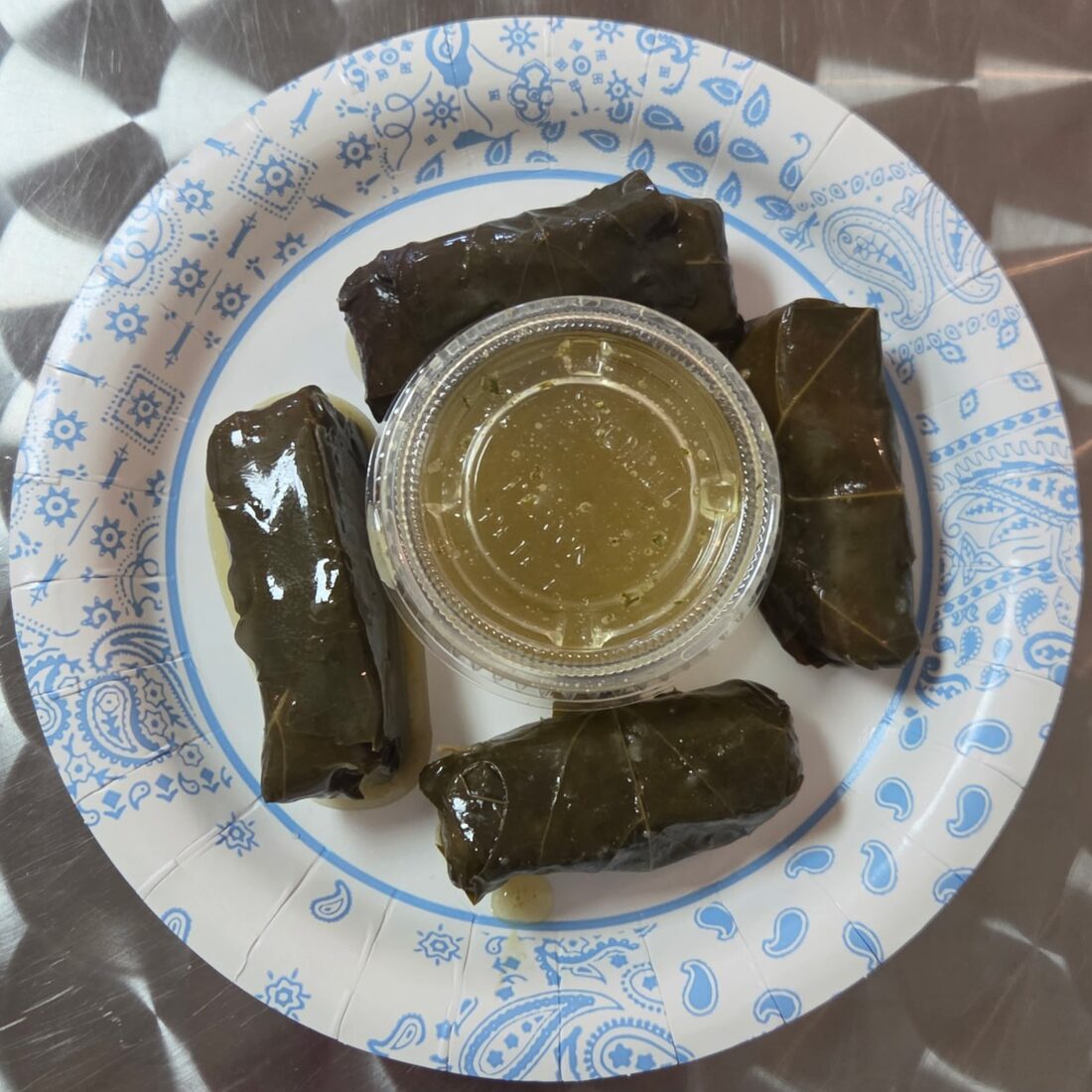 4 Dolmades — Four stuffed grape leaves